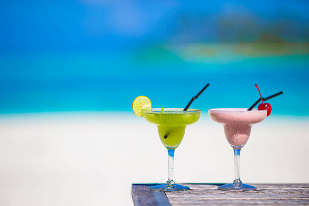 istock Two tasty cocktails on tropical white beach 476370518