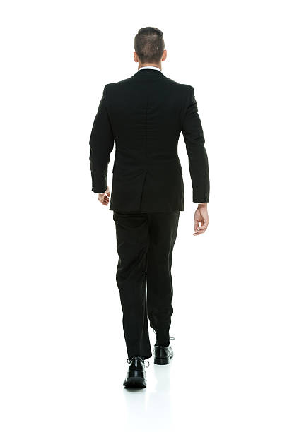 istock Rear view of businessman walking 476373944