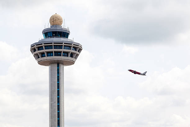 istock Singapore Changi Airport Traffic Controller Tower With Plane Takeoff 476373950