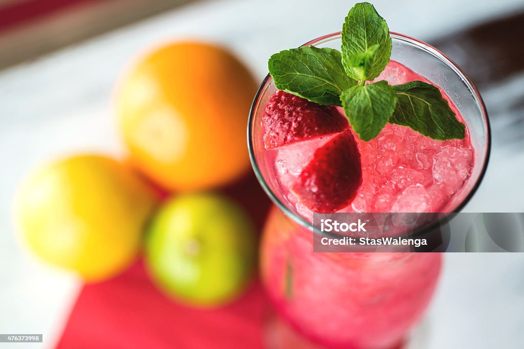 Strawberry cocktail decorated with mint in glass. Selective focus 2015 Stock Photo