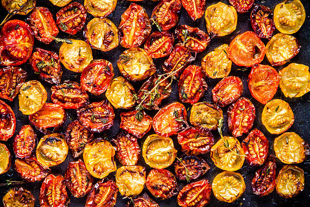 istock sun-dried yellow and red cherry tomatoes with olive oil 476374056
