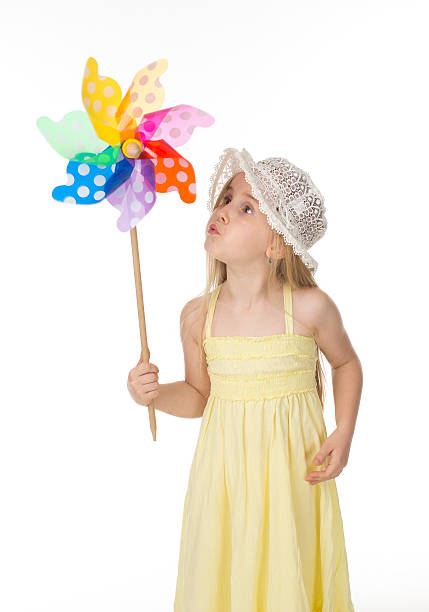 istock beautiful child in yellow dress 476374367