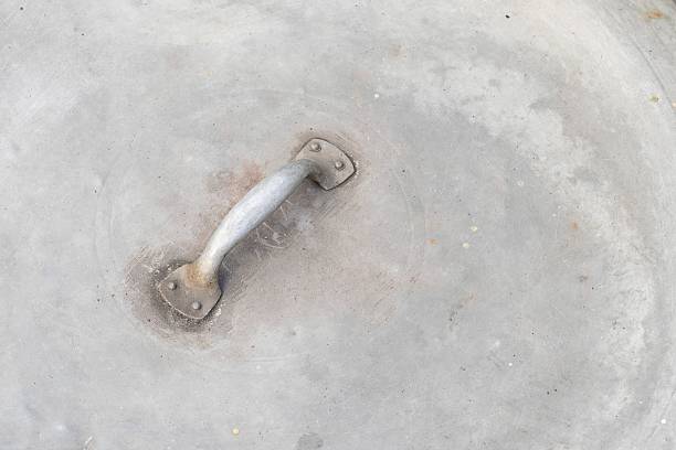 Handle of big old metal circle cover