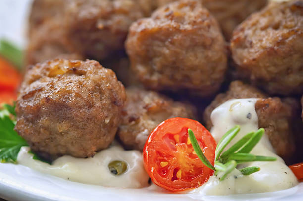 istock Meatballs with sauce and fresh tomatoes 476375500
