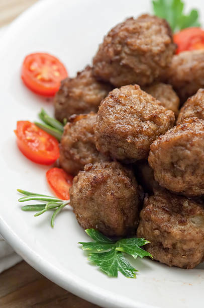 istock Meatballs with sauce and fresh tomatoes 476375502