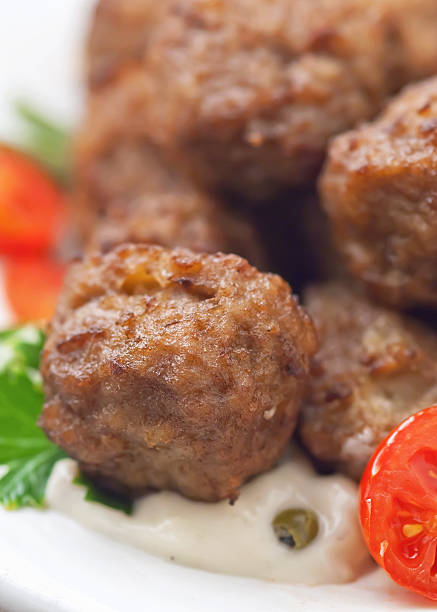 istock Meatballs with sauce and fresh tomatoes 476375504