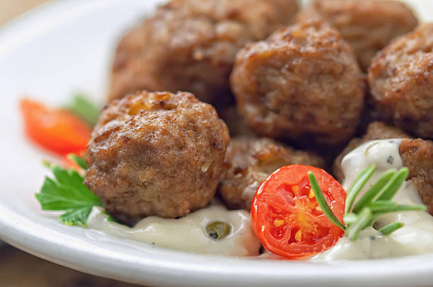 istock Meatballs with sauce and fresh tomatoes 476379312