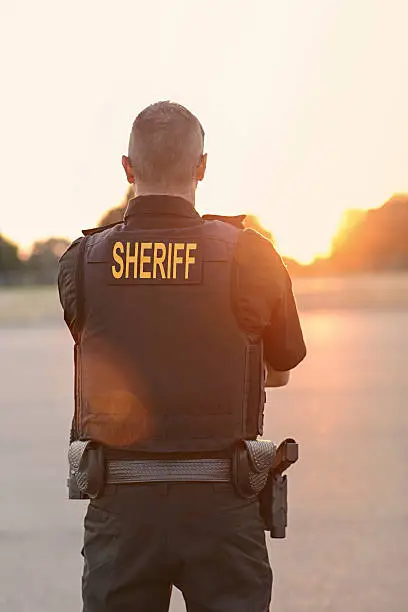 Photo of County Sheriff Police Officer at sunset