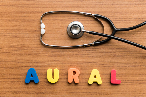 Aural   colorful word with Stethoscope on wooden background