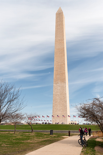 Washington DC, United States of America - April 5, 2015: The Mall, Washington Monument in Washington DC, United States - Famous travel Place, Outdoors in daylight with clear blue sky and people on a background