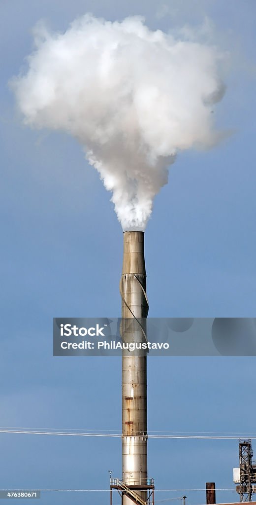 Smoke from chimney at sugar beet processing plant Smoke rising from smoke stack at sugar beet processing plant in Montana Agriculture Stock Photo