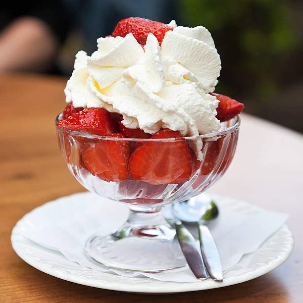 istock Coupe glass strawberries with cream 476383465
