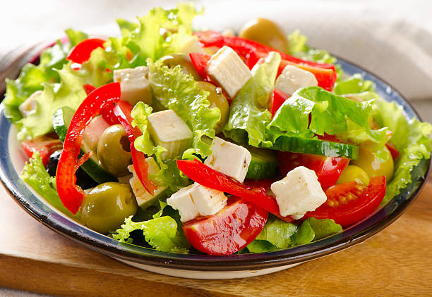 istock Fresh   salad with feta and olives  . 476387906