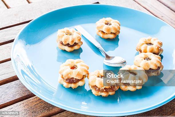 Smiling Face Of Pineapple Biscuits On Wood Table Stock Photo - Download Image Now - Arranging, Bakery, Blue