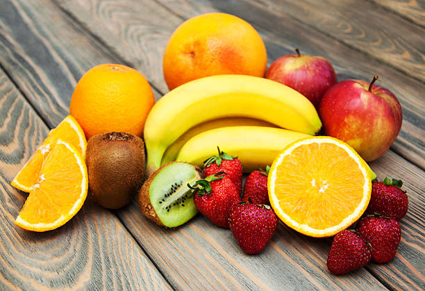istock Fruits on a wooden background 476392918