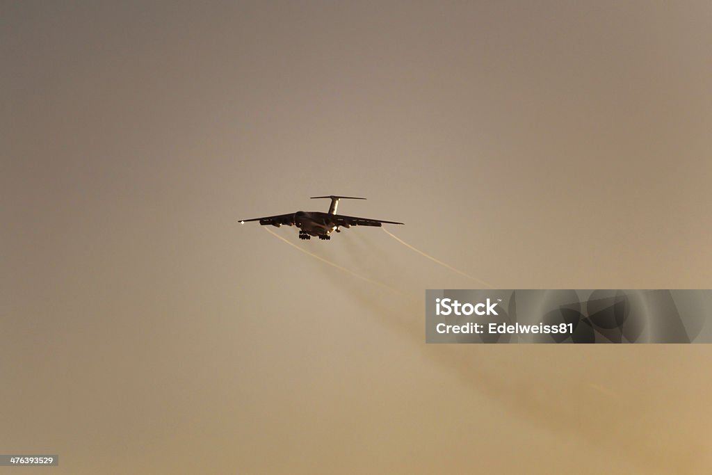 Airplane A plane flying up in the sky in the sunset Aerospace Industry Stock Photo