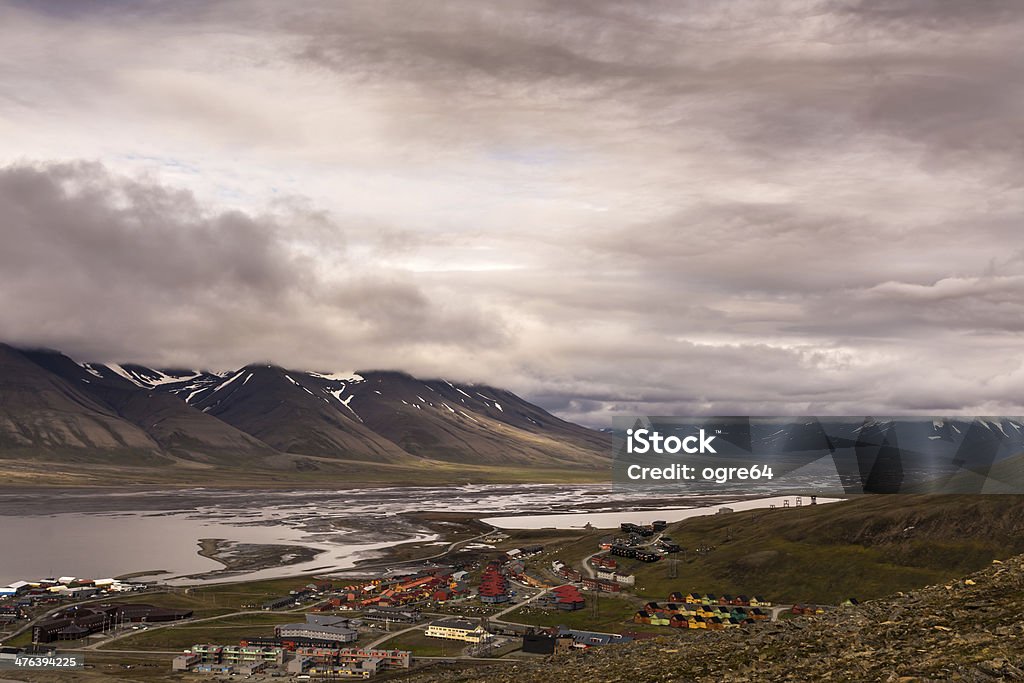 Longyearbyen Longyearbyen seen from a nearby mountain with the mountain in the background. Arctic Stock Photo