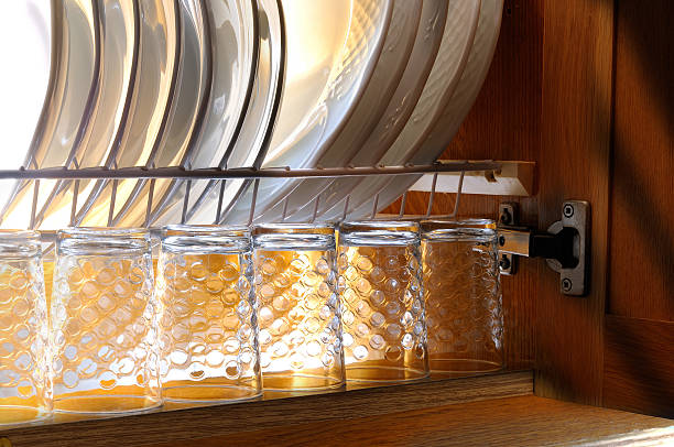 istock Dishes in the draining of a kitchen cabinet house 476396592