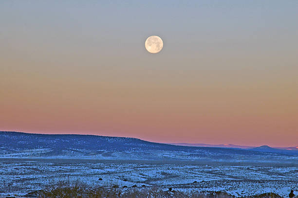 Moonset on a frozen morning stock photo