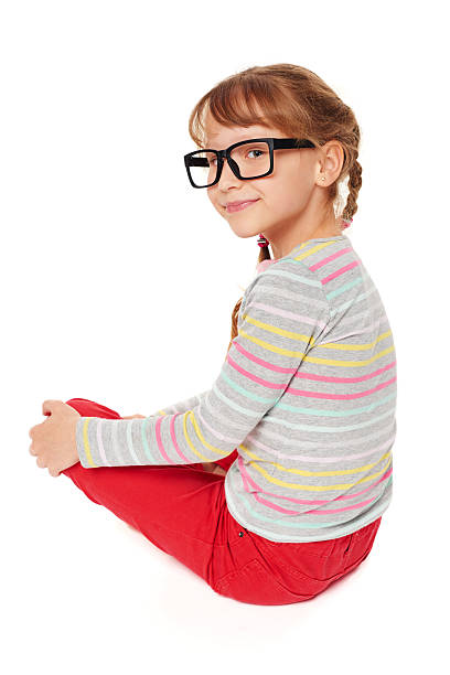 istock Smiling little girl sitting on floor 476399278