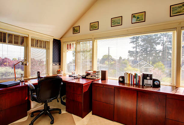 istock Cozy ivory office room wtih cherry wooden storage cabines 476406399