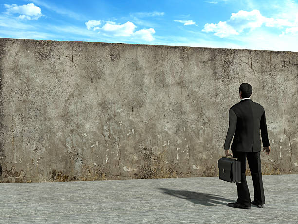 istock Businessman looking at concrete wall 476406510