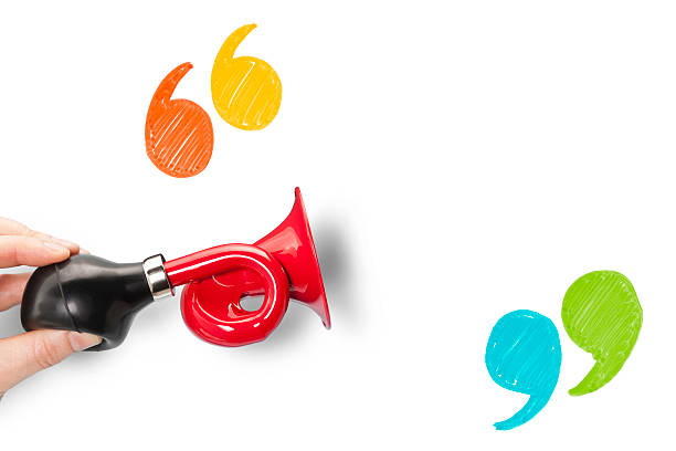 Announcement trumpet and quote marks with blank space stock photo