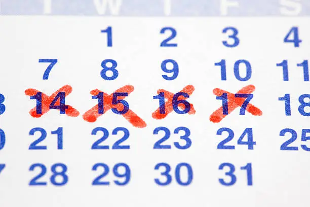 Calendar with dates crossed out.