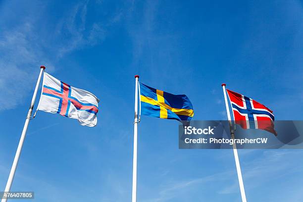 Flags Of Faeroe Islands Sweden And Norway Stock Photo - Download Image Now - Blue, Cloud - Sky, Cloudscape