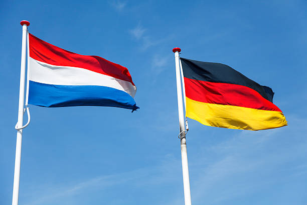 Flags of the Netherlands and Germany stock photo