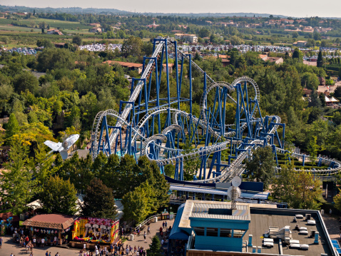 Castelnuovo del Garda, Italy - September 7, 2013: Gardaland is an amusement park located in North-Eastern Italy Ronchi in the municipality of Castelnuovo del Garda, in the province of Verona. Top view of Mountain Russian high-speed called Blue Vertigo.