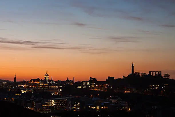 Photo of Edinburgh skyline at night.