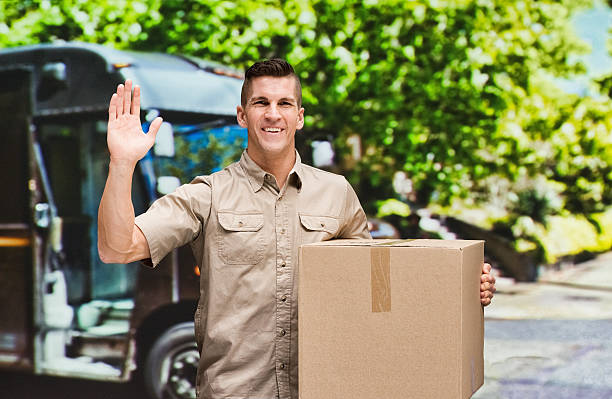 istock Smiling man outdoors and waving hand 476408740