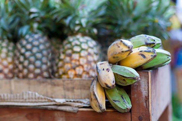 Bananas and pineapple on market