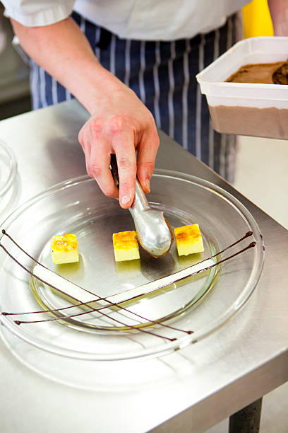 istock Chef adding chocolate mousse to the dessert plate 476409107