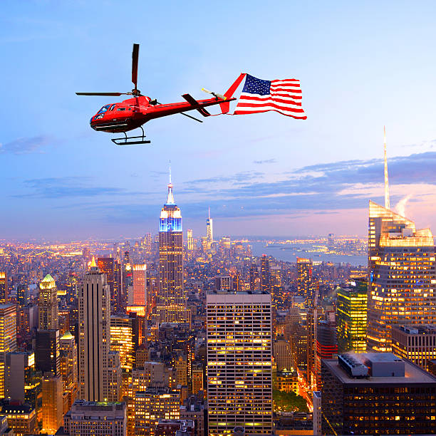 istock Helicopter flying over Empire State Building, NYC. Aerial View 476414910