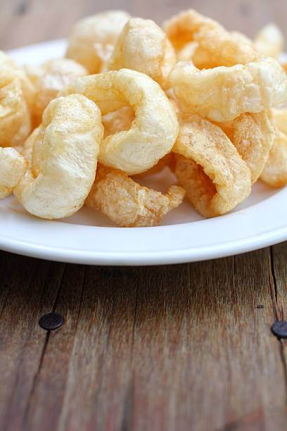 istock Fried Pork Skin on wood 476417289