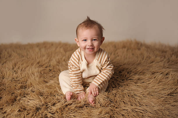 istock Smiling Baby Wearing Knit Outfit 476422849