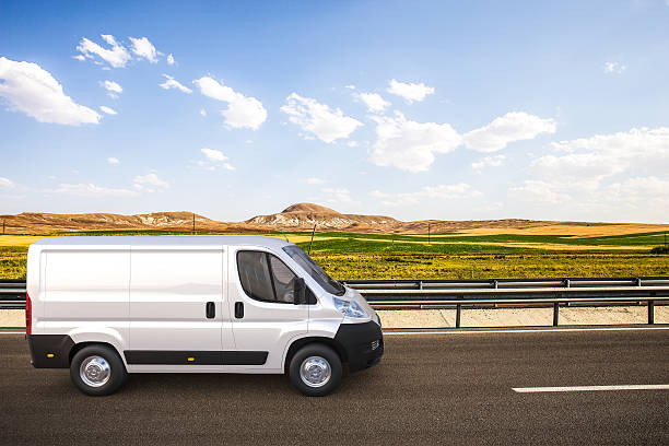 istock White delivery van on the road with colorful background 476423476