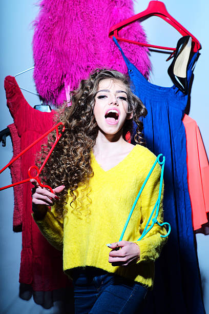 istock Attractive young girl with clothes 476423598