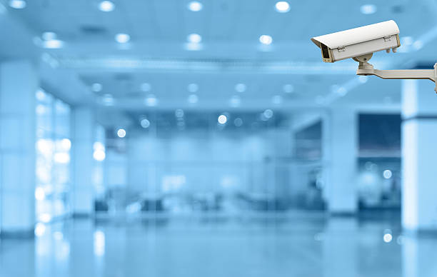 istock Security camera monitoring the store and escalator blur with bok 476423606
