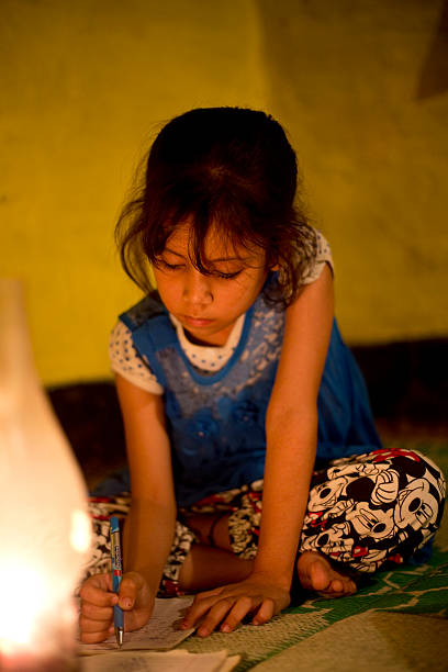 istock Rural girl studying in lantern 476428756
