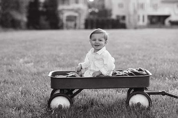 istock Happy Baby Sitting in Wagon 476430759