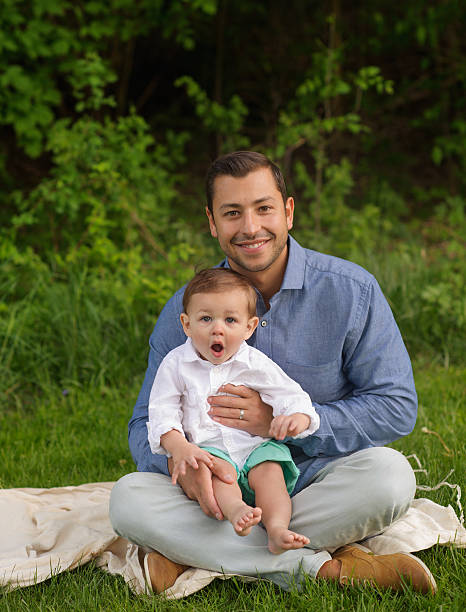istock Father Holding Son With Silly Look on Face 476430833