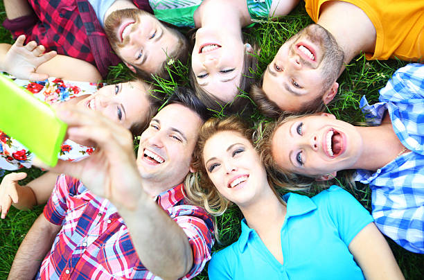 istock Friends taking selfie in grass. 476431386