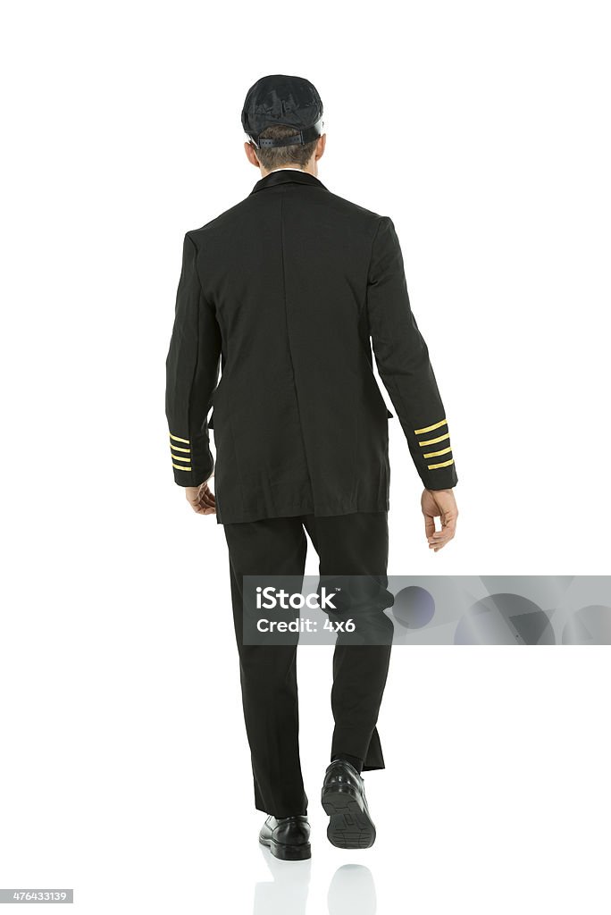 Vista posteriore di un pilota a compagnie aeree - Foto stock royalty-free di Vista posteriore