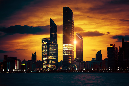 View of Abu Dhabi Skyline at sunset, United Arab Emirates, special photographic processing.