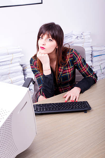 istock Young business woman typing on keyboard in office 476433703