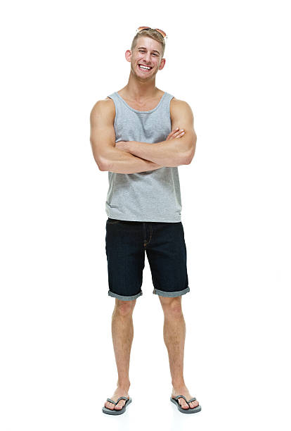 istock Cheerful casual man standing with arms crossed 476435702