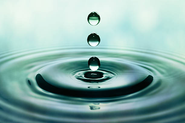 istock Falling green drops of water 476436563